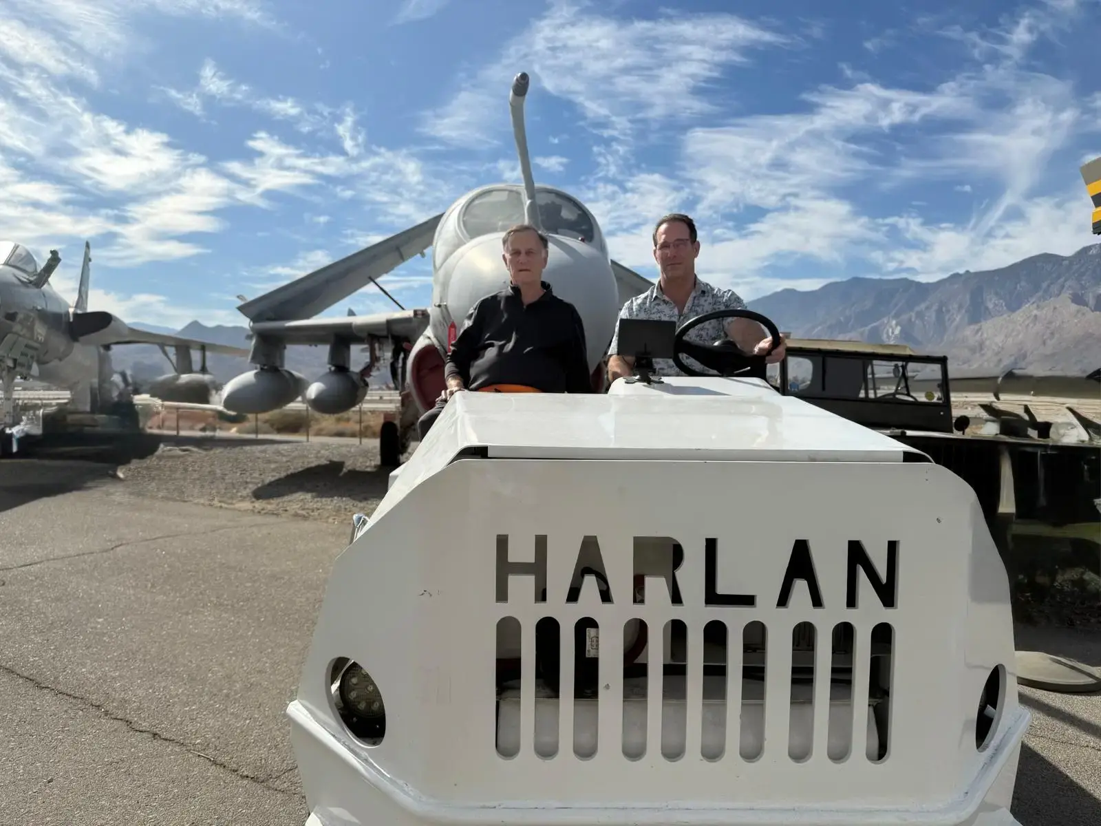 Harlan leadership displaying the strength of the HT Classic, capable of towing military jets and helicopters