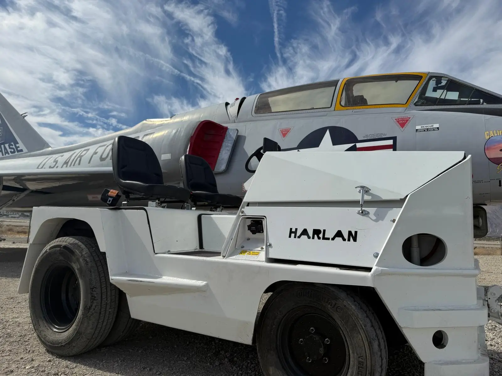 “Electric Ground Support Equipment operating on airport runway - Harlan Global Manufacturing” “Electric Ground Support Equipment operating on airport runway - Harlan Global Manufacturing”